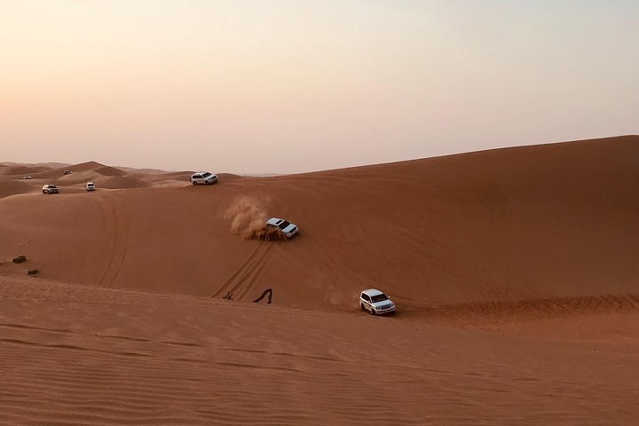 Abu Dhabi Desert Safari with BBQ Dinner,Sandboarding & Camel Ride - Image 1