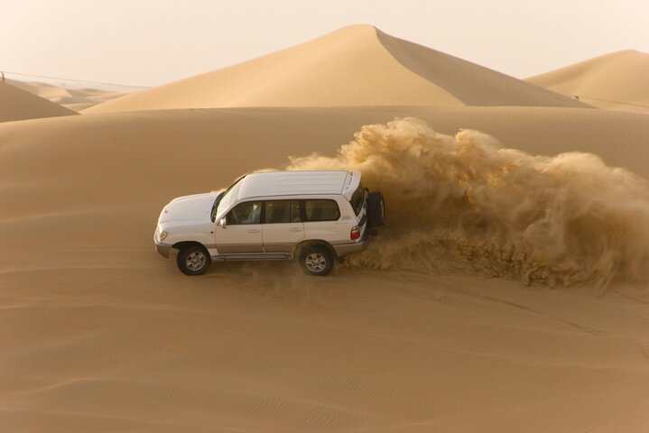 Desert Safari Abu Dhabi w/ Sand Boarding, Camel Ride & BBQ Dinner - Image 2