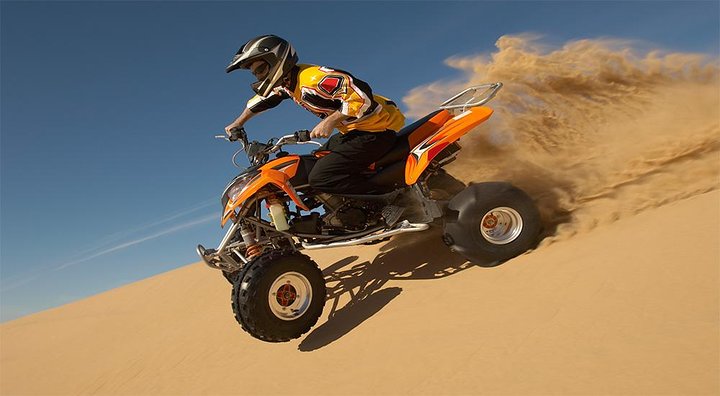 30 Mins Quad Bike, Desert Safari with BBQ Dinner and Camel Ride in Dubai - Image 1