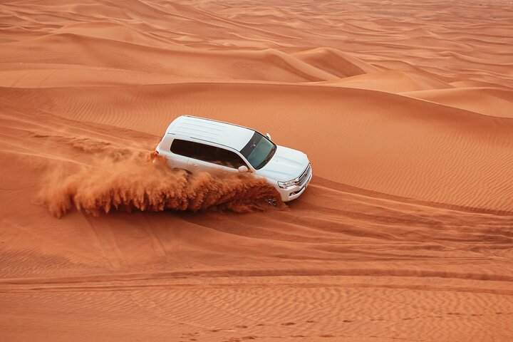 4WD Red Dune Desert Safari with BBQ-dinner, live shows & more - Image 1