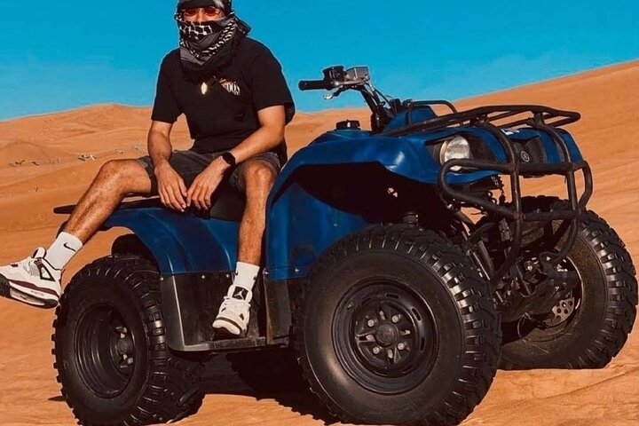 Desert Safari Dubai 25 minutes Quad Bike Free Camel Ride BBQ Dinner - Image 1