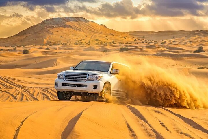 Desert Safari with BBQ Dinner and Camel Ride Experience in Dubai - Image 1