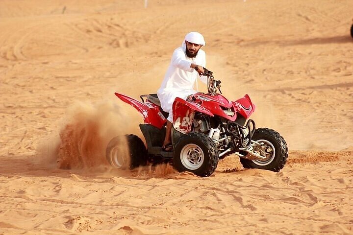 Desert Safari With BBQ Dinner, Quad Bike And Camel Ride Experience from Dubai - Image 1