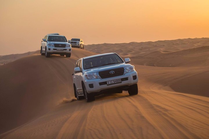 Desert Safari with Quad Bike Sand Boarding and a Camel Ride - Image 5