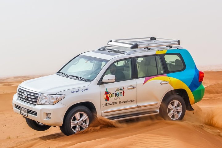 Dubai Desert 4x4 Safari with BBQ Dinner, Camel Ride,Sand boarding - Image 1