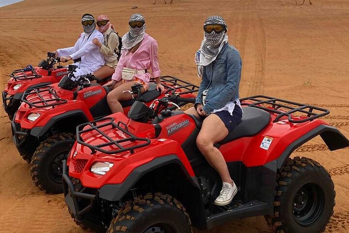 Dubai Desert Quad Bike Ride Adventure And BBQ Dinner Camp - Image 1