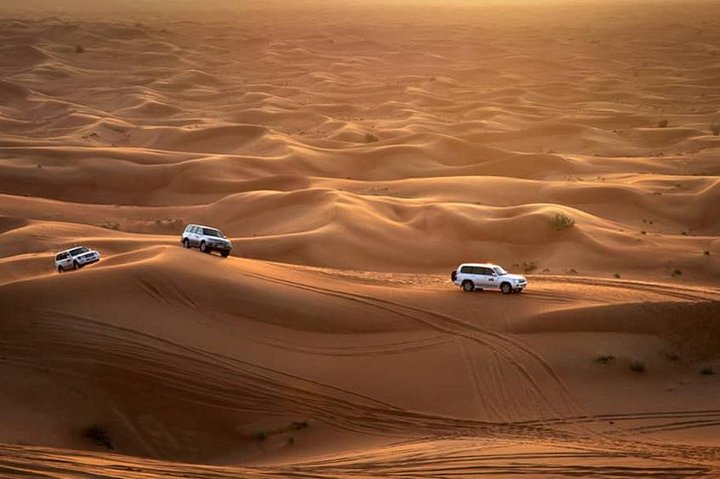 Dubai: Desert Quad Bike Safari, Camel Ride, Sand Surf, & BBQ - Image 1