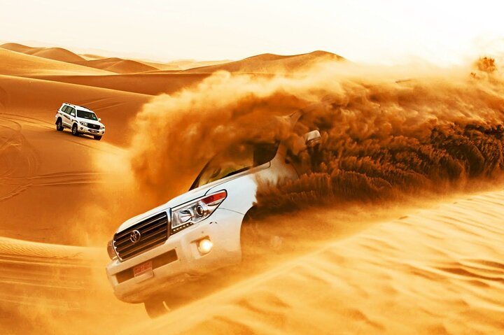 Dubai Desert Safari with Dune Bashing, Camel rides & BBQ Dinner - Image 1