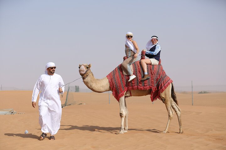 Dubai Desert Safari with Quad Bike, Dune Bashing, Camel Ride, Sand Boarding &BBQ - Image 3