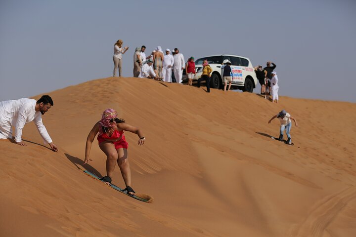 Dubai Desert Safari with Quad Bike, Dune Bashing, Camel Ride, Sand Boarding &BBQ - Image 4