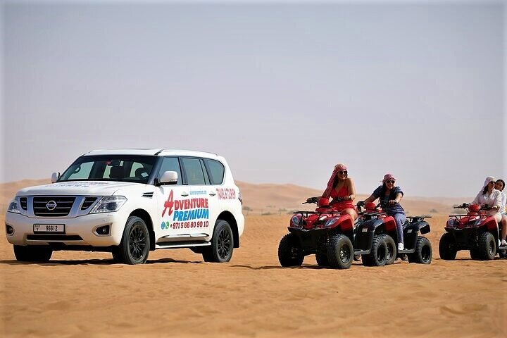 Dubai Desert Safari with Quad Bike, Dune Bashing, Camel Ride, Sand Boarding &BBQ - Image 1