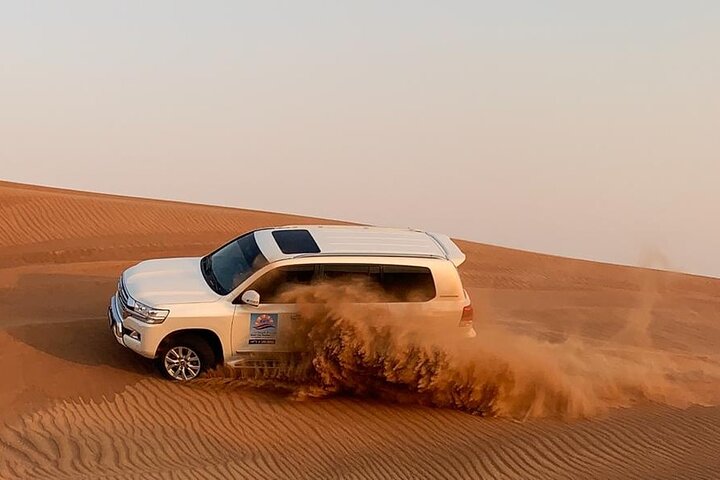 Dubai Evening Desert Safari with Camel Ride, Sand Boarding, BBQ & Entertainment - Image 4