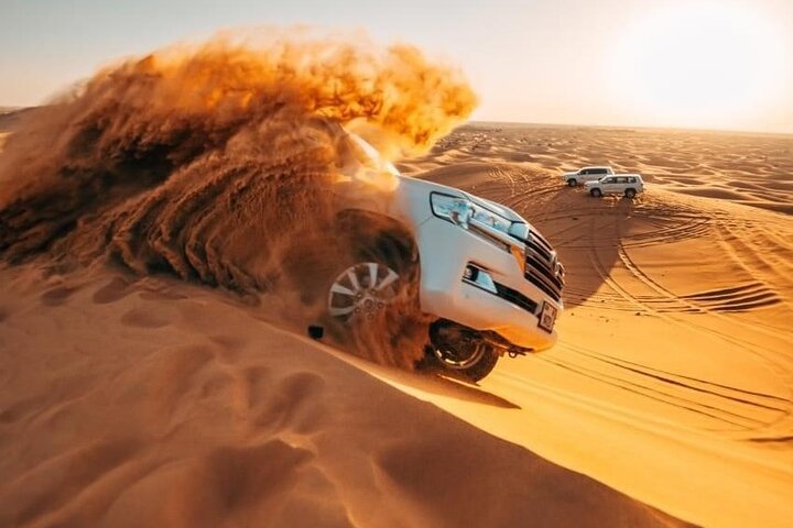 Dubai Evening Desert Safari with Camel Ride, Sand Boarding, BBQ & Entertainment - Image 1