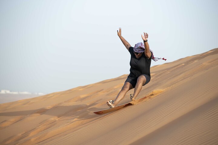 Dubai Half-day Red Dunes bashing with Sandboarding, Camel &Falcon - Image 4