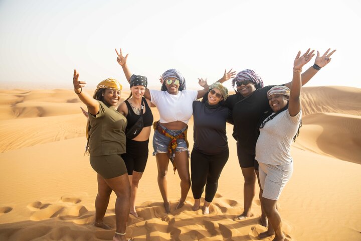 Dubai Half-day Red Dunes bashing with Sandboarding, Camel &Falcon - Image 1