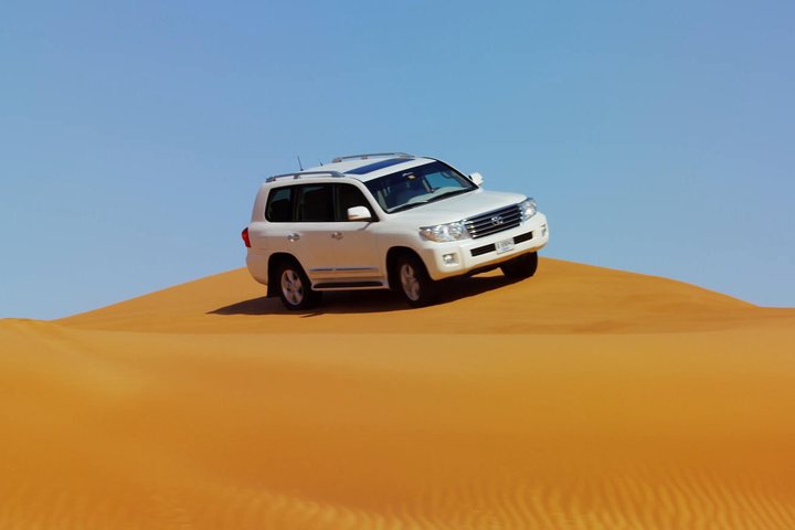 Dubai Red Dune Safari with BBQ Dinner & Live Shows from RAK - Image 1