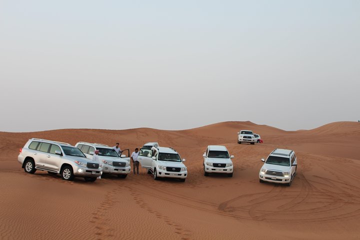 Evening Desert Safari on Red Dunes + Sandboarding + BBQ Dinner & Entertainment - Image 1