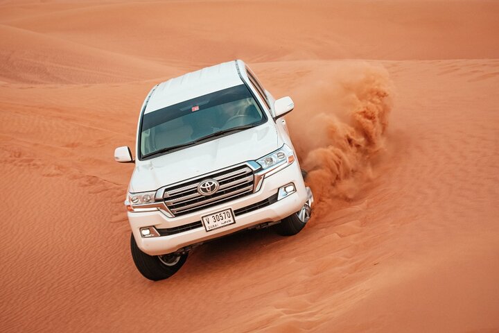 Evening Desert Safari with BBQ Dinner and Camel Ride - Image 1