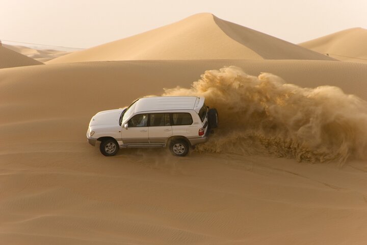 Morning Desert Safari plus Quad Bike, Sandboard and Camel ride - Image 1