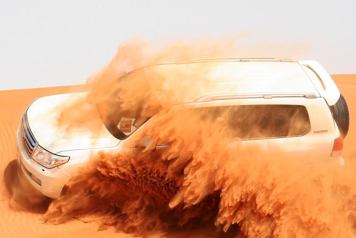 Morning Dubai Desert Safari with Sand boarding and Camel Ride - Image 1