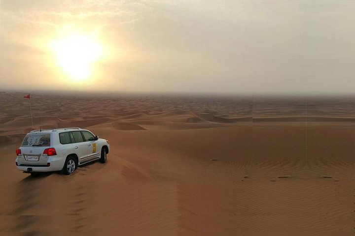 Morning Dune Bashing With Sand Boarding And Camel Ride in Red Dunes Desert  - Image 1