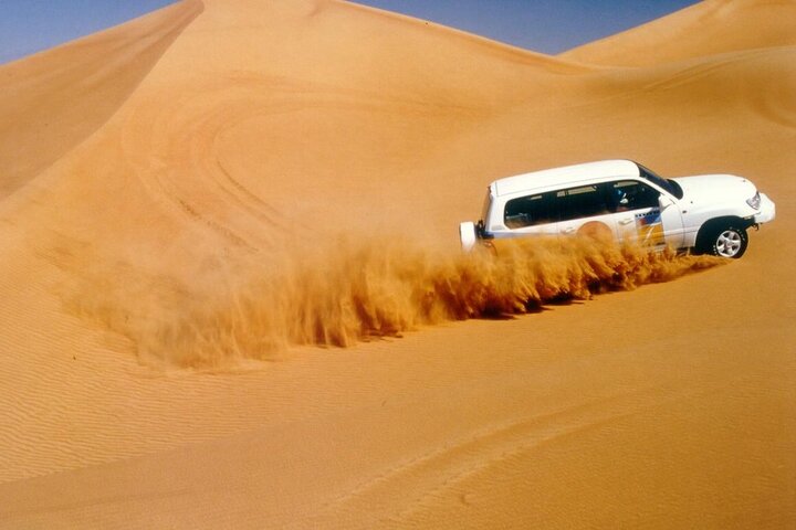 Morning Thrilling Dune bashing , Send Boarding & Camel ride - Image 2