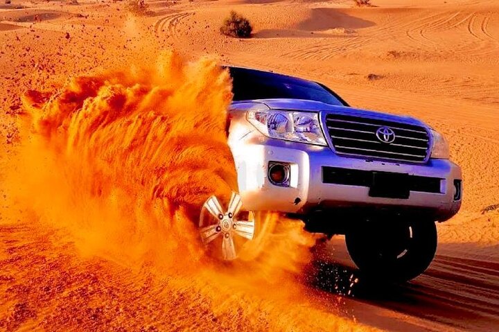 Premium Desert Safari Dubai tour package, BBQ Dinner, Sandboarding, Camel ride - Image 1