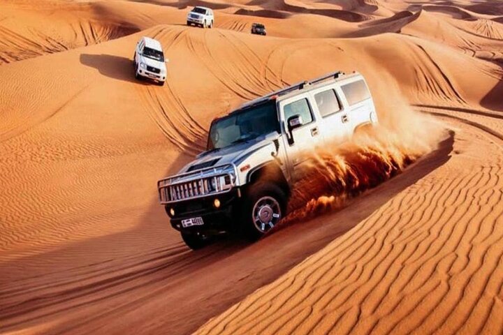Premium Desert Safari with BBQ Dinner,Belly Dance,Camel Riding & Sand Boarding - Image 1