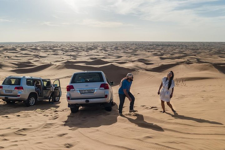 Premium Red Dune Safari with Camel Ride & BBQ Dinner in Bedouin Camp - Image 1
