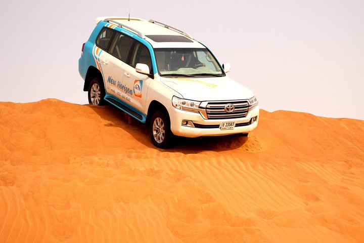 Premium Red Dune Safari with sandboarding, camel ride,Dinner and entertainment  - Image 2