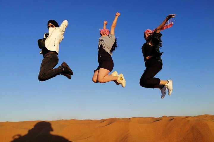 Premium Red Dune Safari with sandboarding, camel ride,Dinner and entertainment  - Image 5