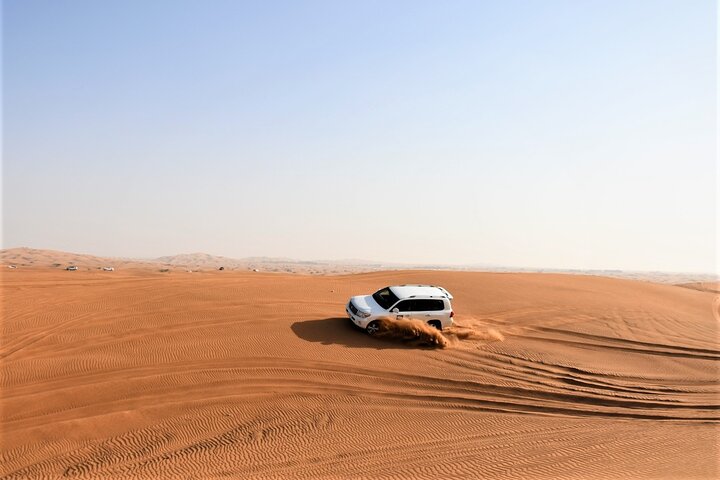 Premium Red Dunes Bashing with Quad Bike, Camel, Falcon &VIP Camp - Image 3