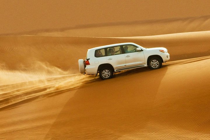 Private Desert Safari Red Dunes with BBQ,Camel Ride,Sand Boarding,Live Shows - Image 1