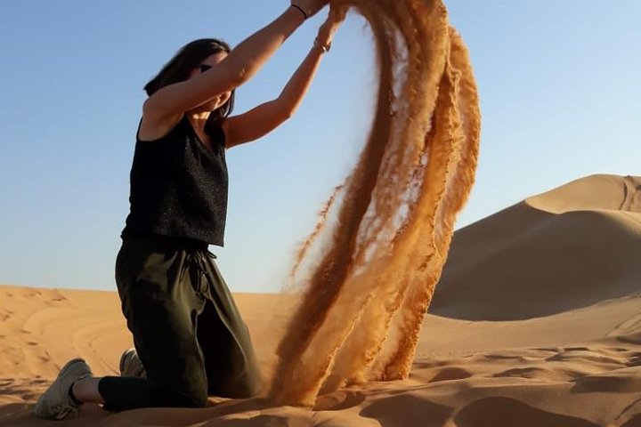 PRIVATE Dubai Desert Safari with BBQ Dinner, Camel Ride, Sand boarding & Shows - Image 3
