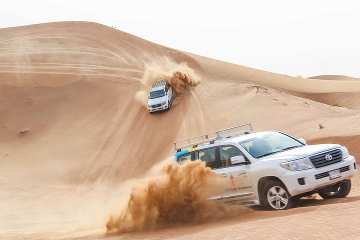 Private Overnight Safari: Sandboarding, Camel Ride, BBQ Dinner and Belly Dancing - Image 4