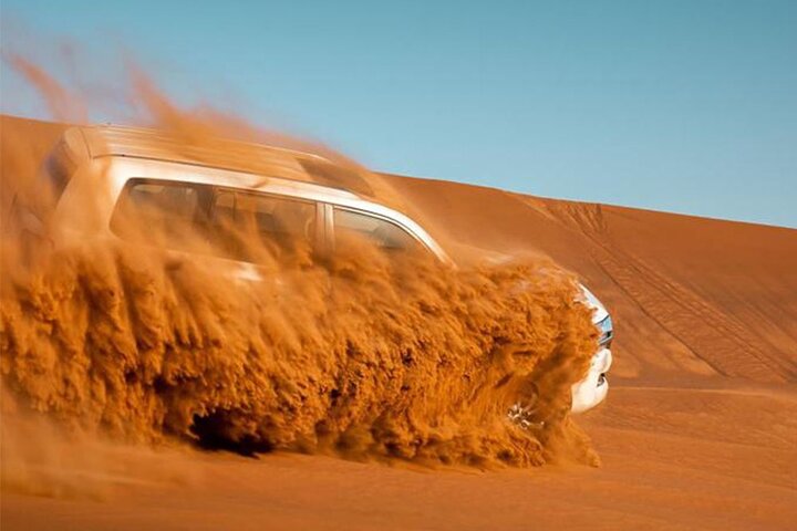 Red Dune Bashing with Camel Ride Sandboard Sunset Pictures & BBQ Dinner - Image 1