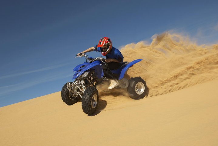 Red Dunes by Quad Bike, Camel Ride, Sandboarding and BBQ - Image 1