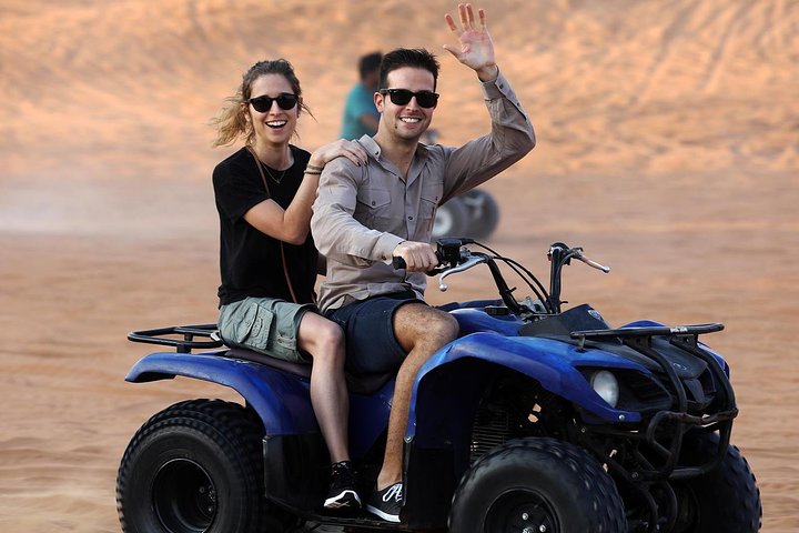 Red Dunes by Quad Bike with VIP Camp, Camels, Sandboarding & Falcon - Image 1