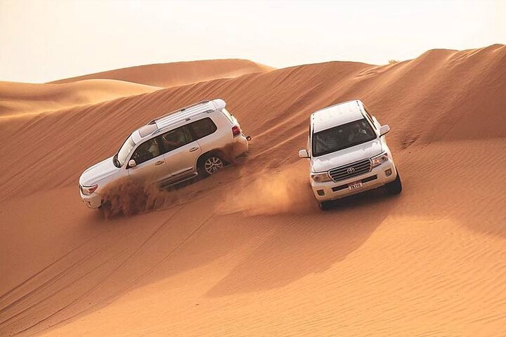 Red Dunes Dubai Desert Safari with Live show, Sandboarding & BBQ - Image 1