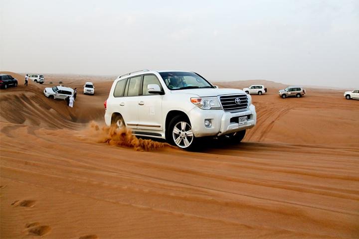Sunset Desert Safari with BBQ, Camel Ride & Sandboarding - Image 1