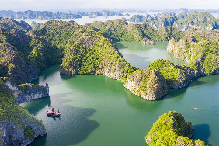 Ha Long Bay Cruise Day Tour with lunch, kayaking, surprise cave & titop island - Image 1