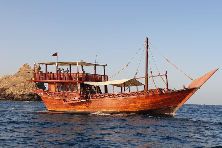 Omani Traditional Dhow Cruise: Sunset and Muscat Coastal View - Image 1