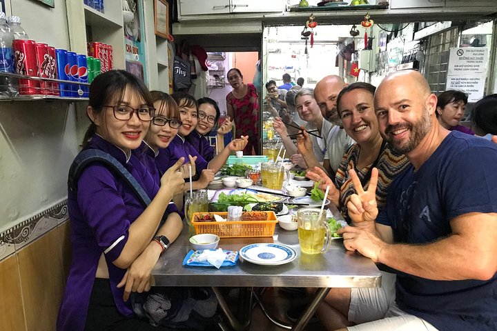 Private Ho Chi Minh Street Food Tour by Motorbike with Ao Dai Female Rider - Image 1