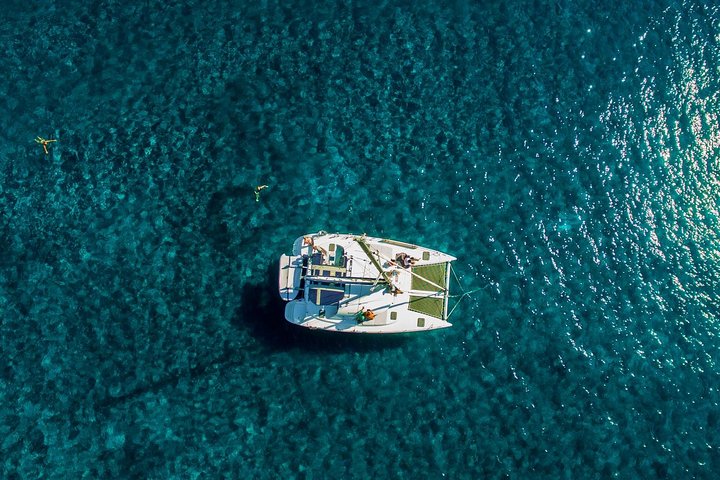 Santorini Half Day Catamaran Private Cruise incl. Meal, Drinks & Free Transport - Image 1