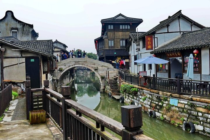 Shanghai Layover Tour to Xinchang Water Town with City Highlights Option - Image 1