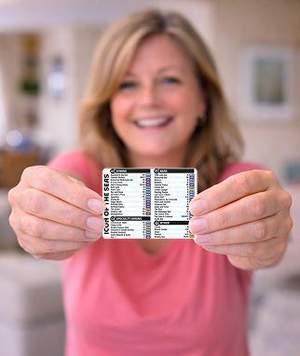 Woman holding Icon of the Seas Cruise Deck Finder Card