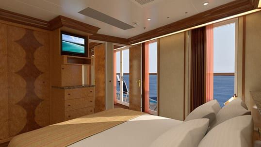 Carnival Legend Vista Suite (VS) bedroom, photo 1 of 4