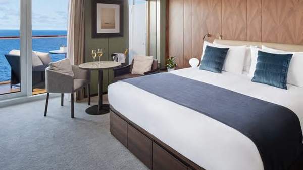 Norwegian Aura The Haven Deluxe Owner's Suite with Large Balcony (H3) bedroom, photo 1 of 2