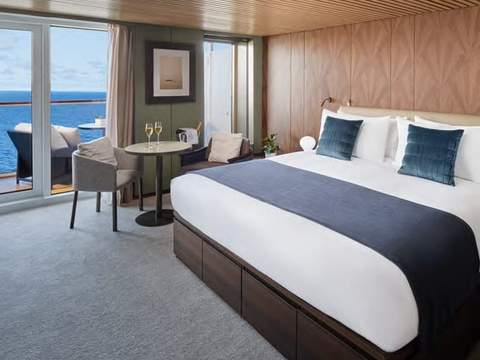Norwegian Aura The Haven Deluxe Owner's Suite with Large Balcony (H3) bedroom, photo 1 of 2