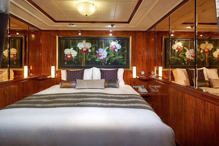 Norwegian Gem 2-Bedroom Deluxe Family Suite with Balcony (S4) bedroom, photo 1 of 2